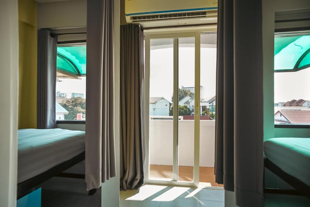 Dorm room at Stamps Backpackers Hostel in Chiang Mai 2025